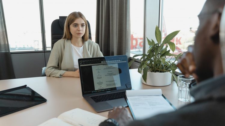 A professional job interview scene in a modern office setting, emphasizing recruitment and career opportunities.