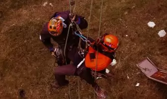 Rope access professionals engaging in technical rescue training during a daring outdoor adventure.